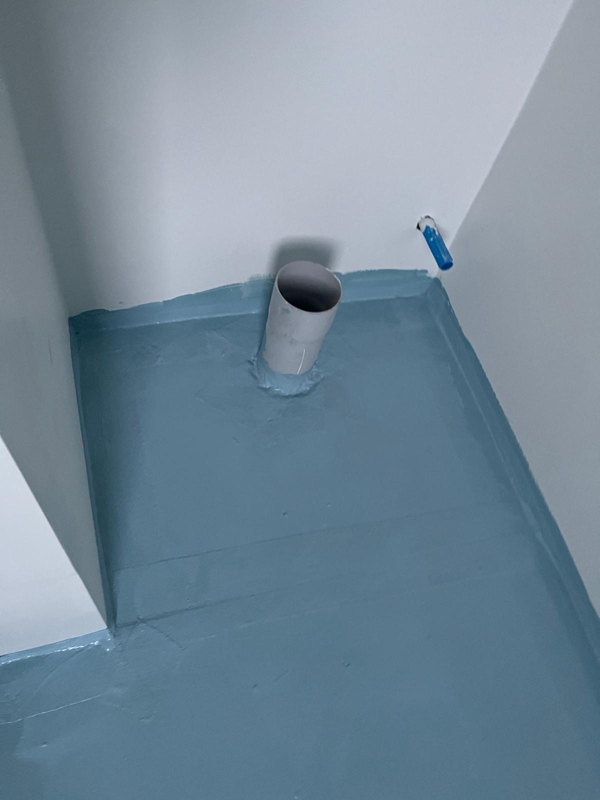 Certified waterproofing membrane in shower corner before tiling